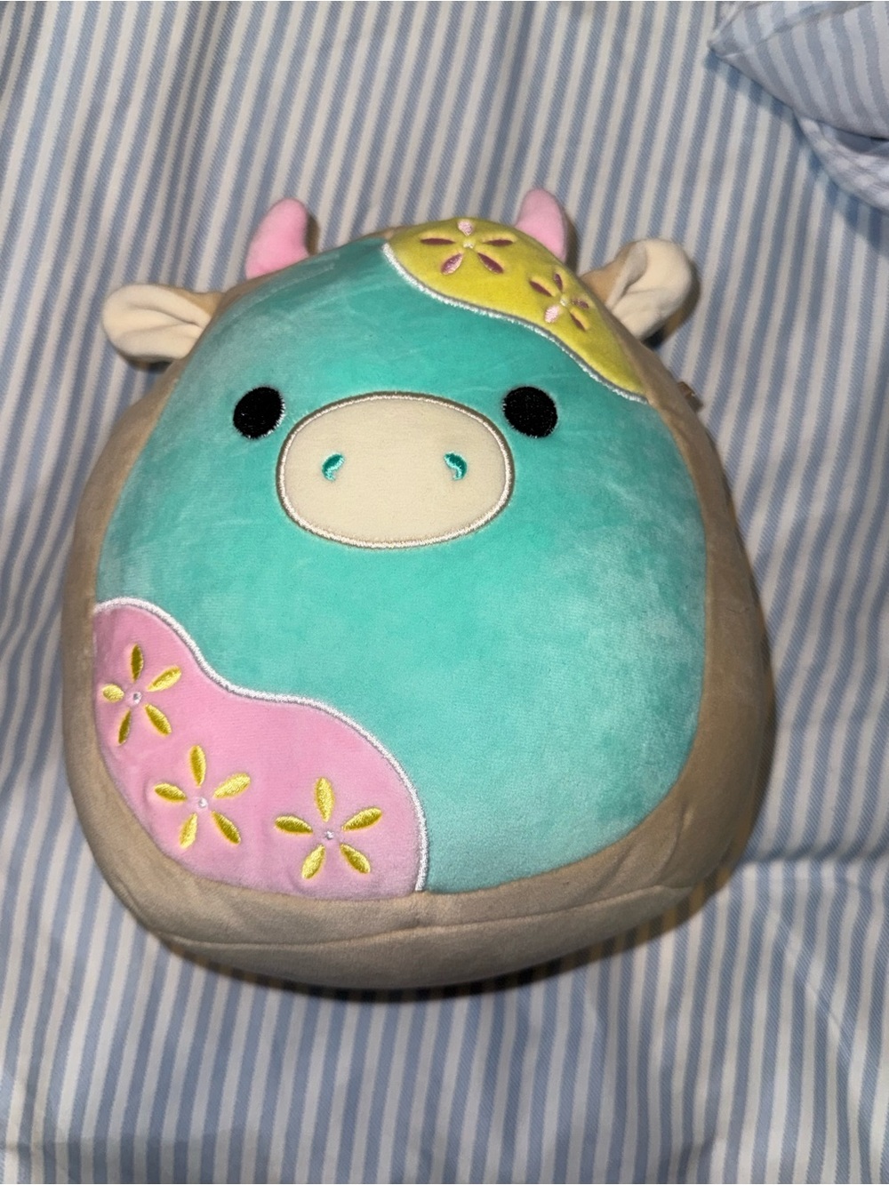 Squishmallows Teal Cow Plush with Pink & Yellow Flower Accents